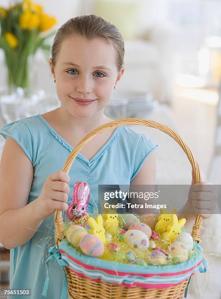 girl holding easter basket - easter basket with candy stock pictures, royalty-free photos & images