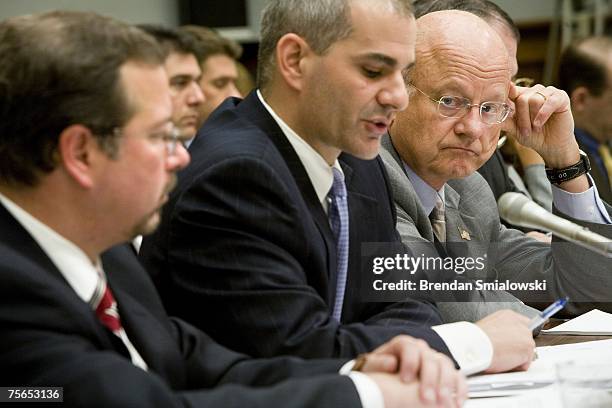 Defense Undersecretary for Intelligence James Clapper listens to Michael Leiter , deputy director of the National Counterterrorsim Center and...