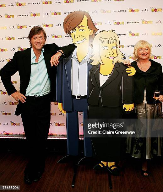Presenters Richard Madeley and Judy Finnigan pose with their Simpsons characters at the UK premiere of "The Simpsons Movie" at The O2, Greenwich on...