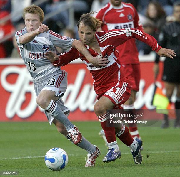 Dallas's Dax McCarty and Chicago Fire's Justin Mapp go for the ball during the first half of a soccer game at Toyota Park in Bridgeview, Ill. On...