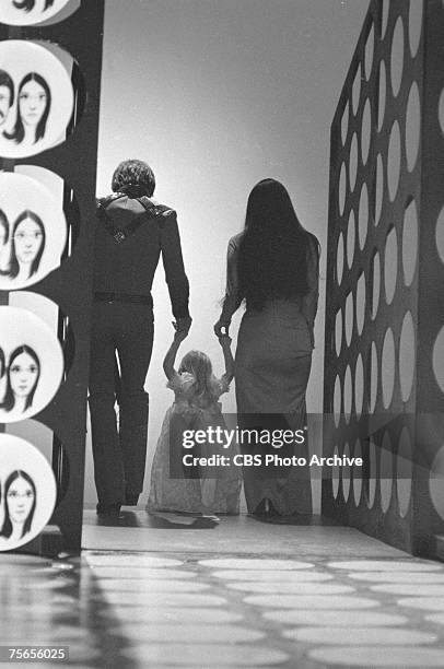 Married American singing and acting duo Sonny Bono and Cher leave the set with their daughter Chastity Bono at the end of an episode of the...