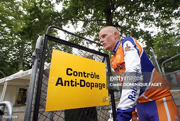 Yellow jersey Denmark's Michael Rasmussen leaves the anti-doping car control after the 12th stage of the 94th Tour de France cycling race between...