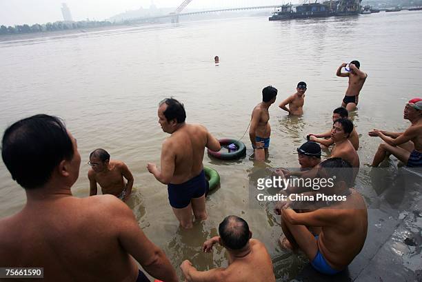 Swimmer rest at the shore of the Hanjiang River, a tributary of the Yangtze River, on July 25, 2007 in Wuhan of Hubei Province, central China. Wuhan...