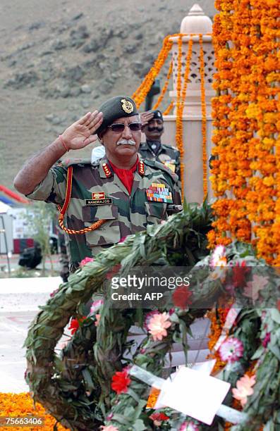 Indian Lieutenant General OP Nandrajog salutes at a war memorial during a wreath laying ceremony during "Vijay Diwas" or 'Victory Day' celebrations...