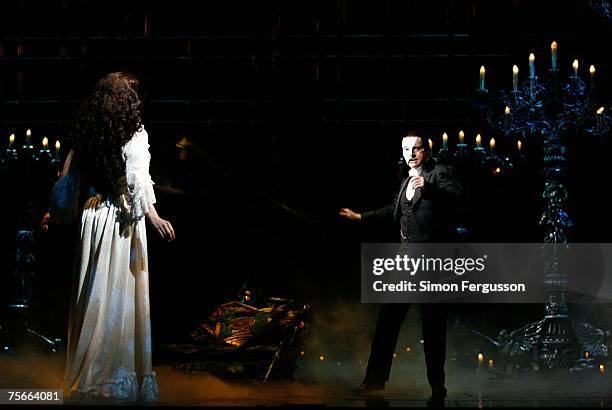 Anthony Warlow and Ana Marina, cast members of The Phantom of the Opera perform on stage at the photo call for the new production of Broadway's...