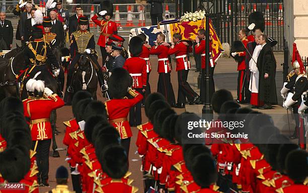 Pall bearers carry the coffin bearing the Queen Mother from the Queen's Chapel in St James's Palace April 5, 2002 to begin a ceremonial procession...