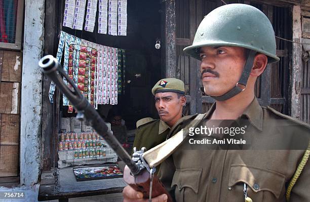Indian police stand guard March 9, 2002 in the northern Indian city of Ayodhya. India struggles to cool tensions after bloody Hindu-Muslim communal...
