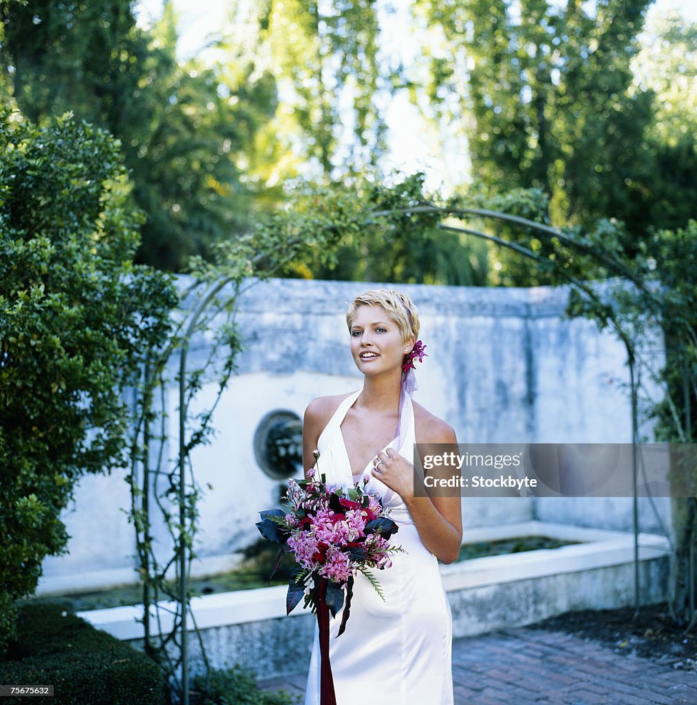 Bride standing on lawn