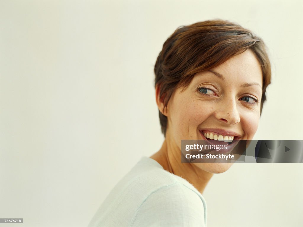 Young woman looking away, close-up