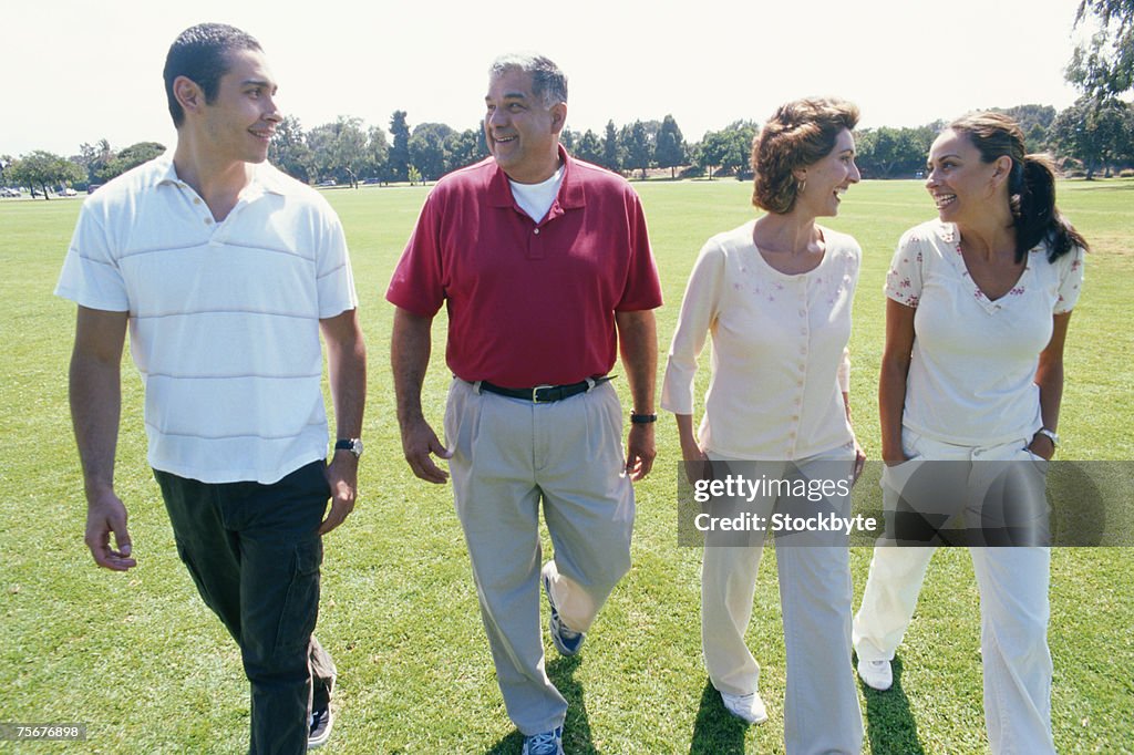 Family walking together, smiling