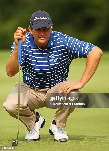 Retief Goosen of South Africa lines up his putt on the 15th hole during the first round of The Deutsche Bank Players Championship of Europe at Gut...