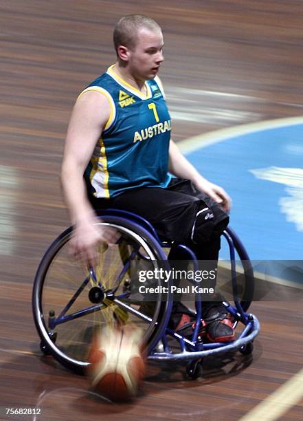 Shaun Norris of the Rollers dribbles the ball during game two of the four-game international wheelchair basketball series between the Australian...