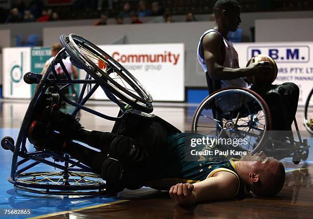 Shaun Norris of the Rollers lies on the court after being involved in a collision with another player during game two of the four-game international...