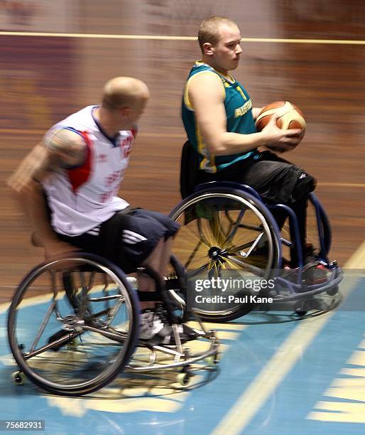 Shaun Norris of the Rollers dribbles the ball during game two of the four-game international wheelchair basketball series between the Australian...
