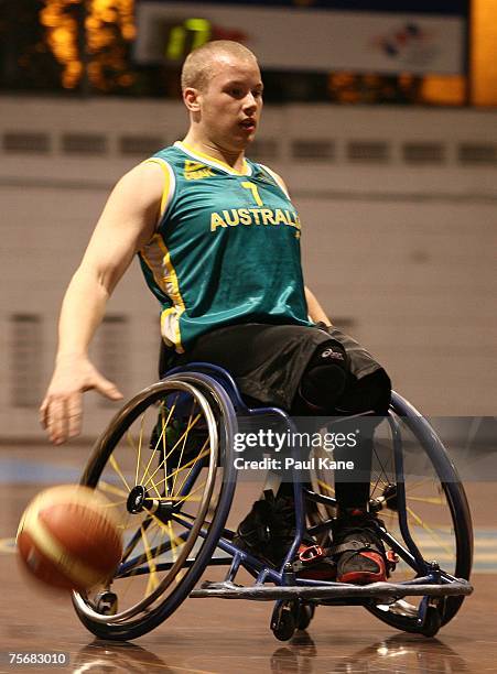 Shaun Norris of the Rollers dribbles the ball during game two of the four-game international wheelchair basketball series between the Australian...
