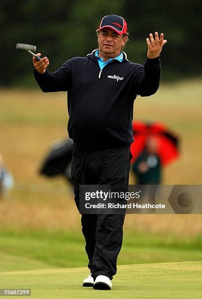 Costantino Rocca of Italy reacts to a putt on the 5th green during the first round of The Senior Open Championship 2007 at the Honourable Company of...