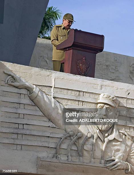 Cuba's interim President Raul Castro gives a speech at the Revolution Square in Camaguey, 600 km east from Havana, next to a bas-relief of President...