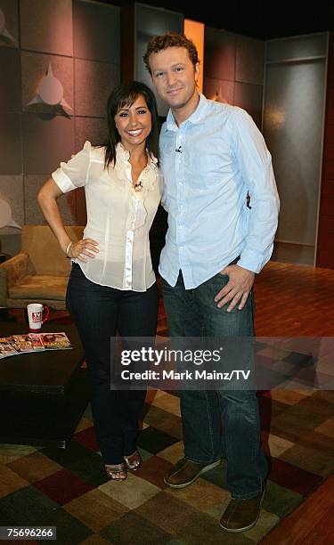 Show host Nikki Boyer and actor Devon Gummersall pose on the set at the Television Guide Channel Studios on July 18, 2007 in Hollywood, California.