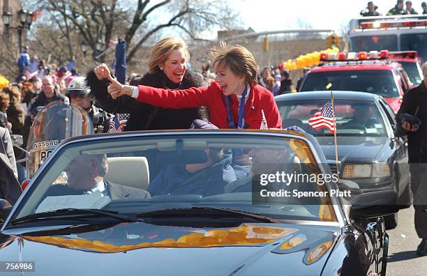 Olympic figure skating gold medalist Sarah Hughes and her coach Robin Wagner wave to people at a parade in Hughes'' honor March 10, 2002 as they are...