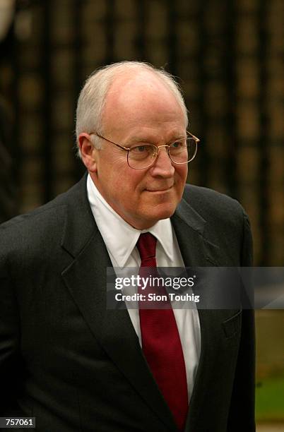 Vice President Dick Cheney walks to his limousine March 11, 2002 after meeting with British Prime Minister Tony Blair at 10 Downing Street in London....