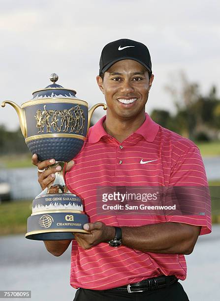 Tiger Woods holds the Gene Sarazen trophy after winning the WGC-CA Championship held on the Blue Course at Doral Golf Resort and Spa in Doral,...