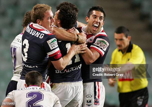 Braith Anasta and Mitchell Aubusson of the Roosters celebrate after a try during the round 20 NRL match between the Sydney Roosters and the Melbourne...