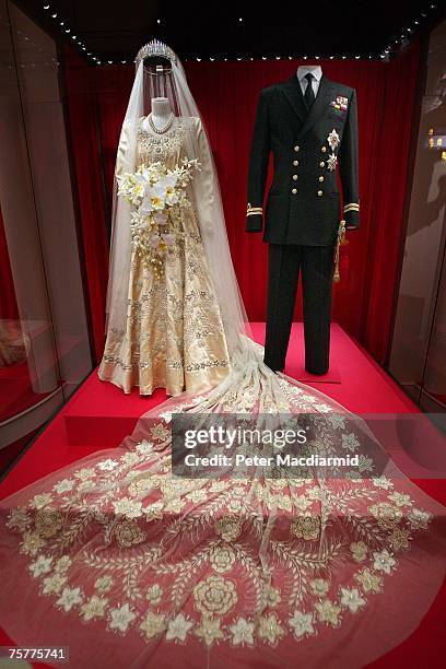 Princess Elizabeth's wedding dress, designed by Norman Hartnell, and the Duke of Edinburgh's Royal Naval uniform are displayed at the 'Royal Wedding:...