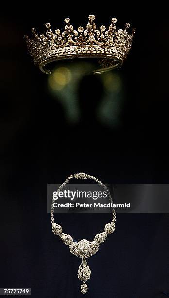 The 'Girls of Great Britain' tiara from Garrards and a Cartier diamond and platinum necklace are displayed at the 'Royal Wedding: 20 Novermber 1957'...