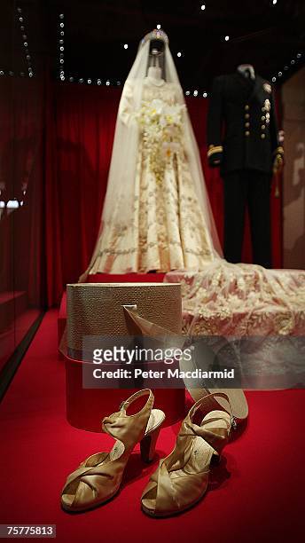 Princess Elizabeth's wedding dress, designed by Norman Hartnell, and the Duke of Edinburgh's Royal Naval uniform are displayed at the 'Royal Wedding:...