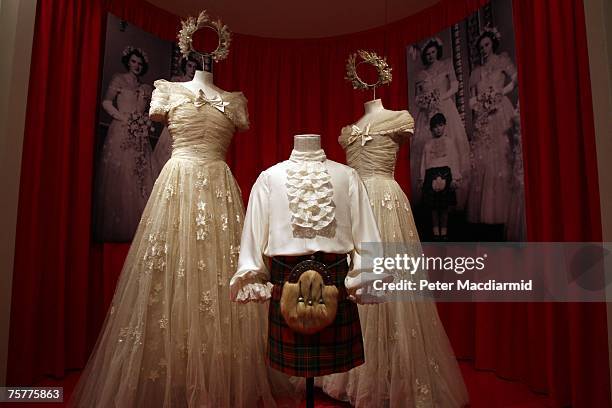 Bridesmaid's dresses and a page boy's outfit is displayed at the 'Royal Wedding: 20 Novermber 1957' exhibition at Buckingham Palace on July 27, 2007...