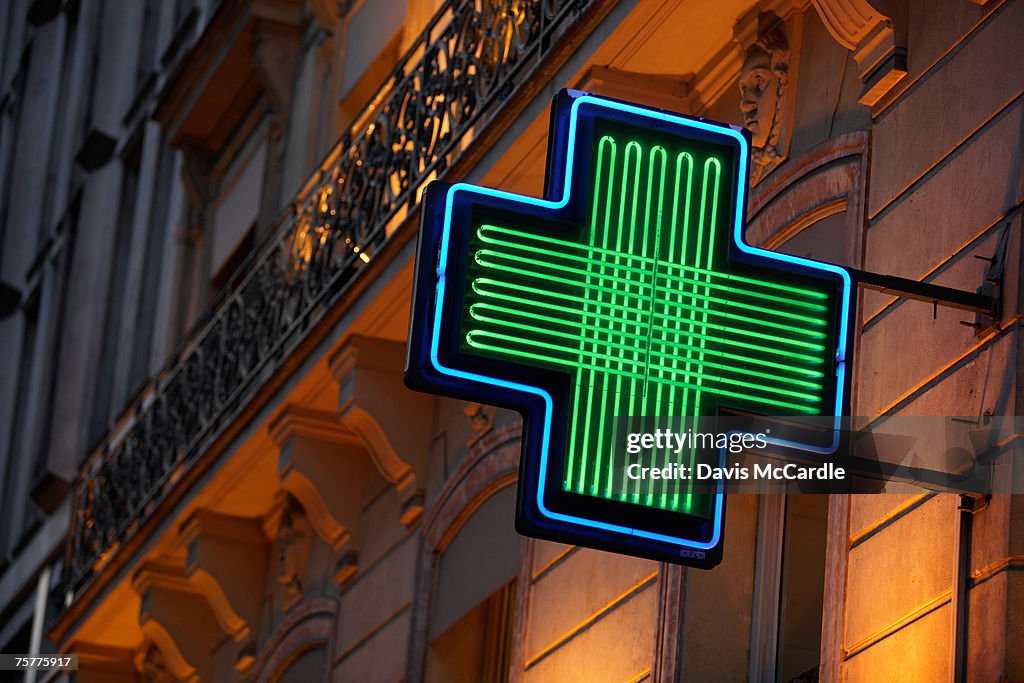 Pharmacy sign in Paris, France