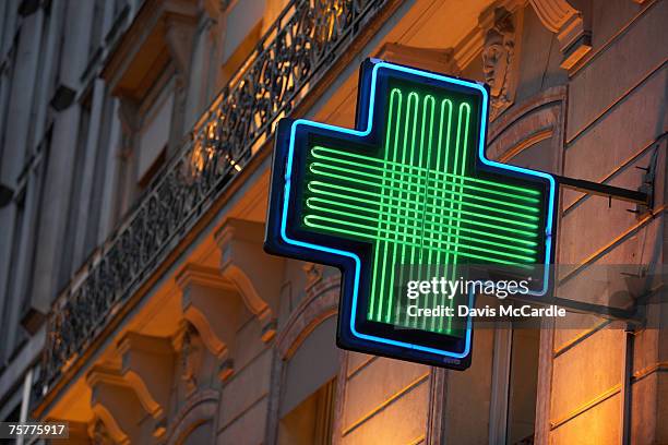 pharmacy sign in paris, france - farmacia imagens e fotografias de stock