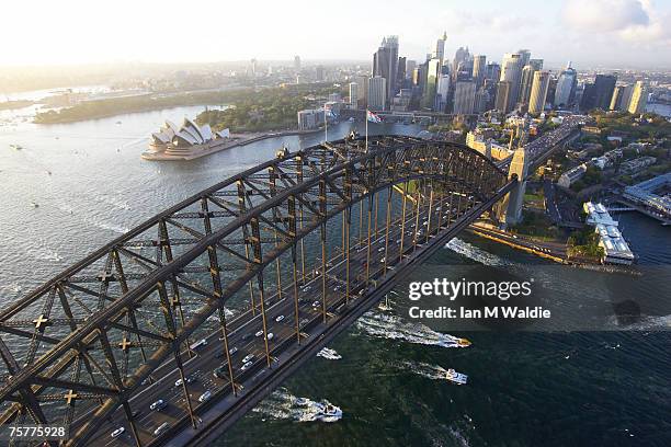 aerial view of the sydney harbour bridge, the sydney opera house and sydney city australia - sydney city stockfoto's en -beelden
