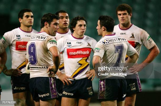 Storm players look dejected after a Roosters try during the round 20 NRL match between the Sydney Roosters and the Melbourne Storm at the Sydney...