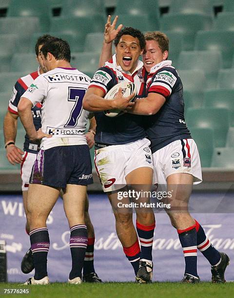 Anthony Tupou of the Roosters celebrates with Mitchell Abusson after scoring a try during the round 20 NRL match between the Sydney Roosters and the...