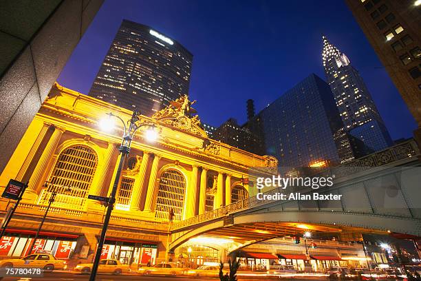 usa, new york, grand central station and metlife building illuminated at dusk - metlife building stock pictures, royalty-free photos & images