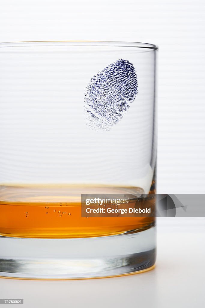 Fingerprint on glass, studio shot