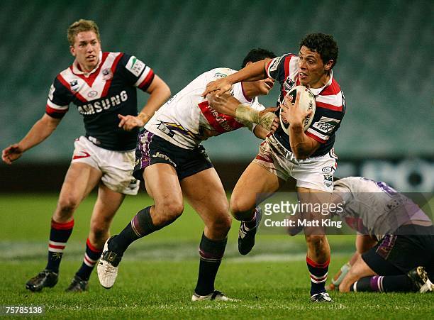 Anthony Tupou of the Roosters takes on the defence during the round 20 NRL match between the Sydney Roosters and the Melbourne Storm at the Sydney...