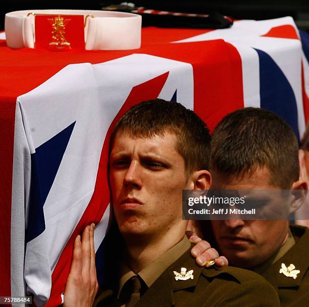 The coffin of Pvt. Scott Kennedy of the Black Watch, the Third Battalion of the Royal Regiment of Scotland, is carried by soldiers on July 27, 2007...