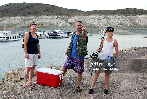 Emin Zahirovic of Nevada points out a rabbit running in the brush to his wife Sabiha Zahirovic and their son Muharem Zahirovic , as they wrap up a...