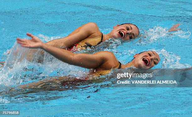 Venezuela's Mary Soto and Anna Soto perform their Synchronized Swimming final routine during the XV Pan American Games Rio-2007 in Rio de Janeiro,...