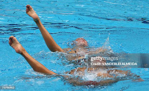 Venezuela's Mary Soto and Anna Soto perform their Synchronized Swimming final routine during the XV Pan American Games Rio-2007 in Rio de Janeiro,...