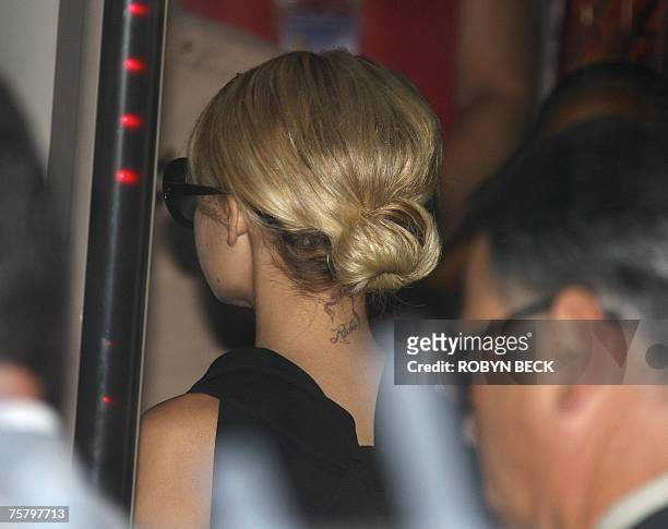 Nicole Richie goes through the metal detector as she arrives at court in Glendale, California 27 July, 2007 to testify on charges of driving under...
