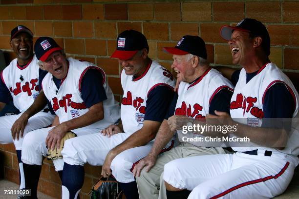 Hall of Fame members Ozzie Smith, Brooks Robinson, Ryne Sandberg, Earl Weaver and George Brett joke around in the dugout during the Play Ball with...