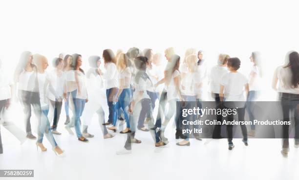 multiple exposure of diverse women walking - fast studio stock pictures, royalty-free photos & images