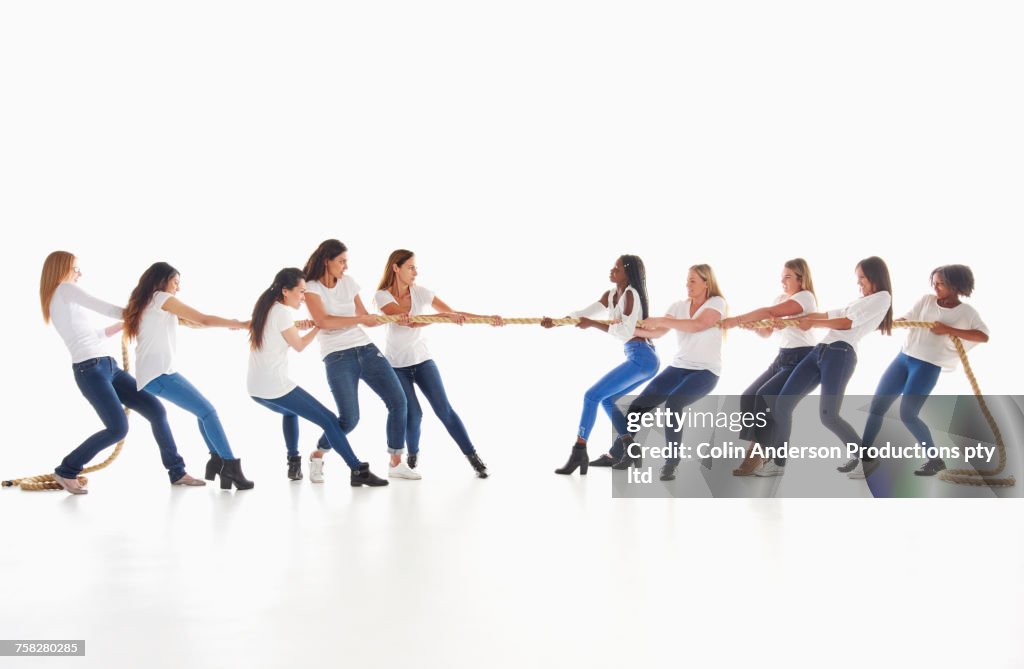 Diverse women playing tug-of-war