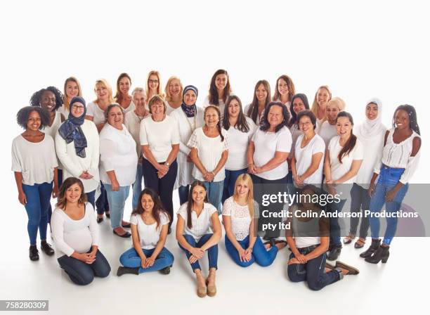 portrait of crowd of diverse smiling women - crowd looking into camera happy indian stock-fotos und bilder