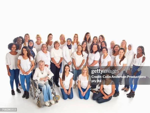 portrait of crowd of diverse smiling women - crowd looking into camera happy indian stock-fotos und bilder