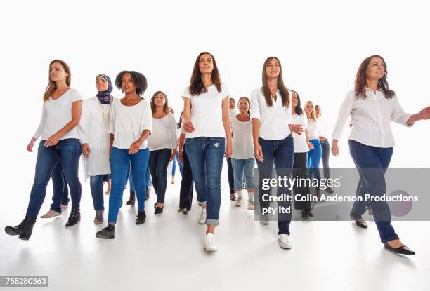 rows of diverse women walking - old jeans stock pictures, royalty-free photos & images