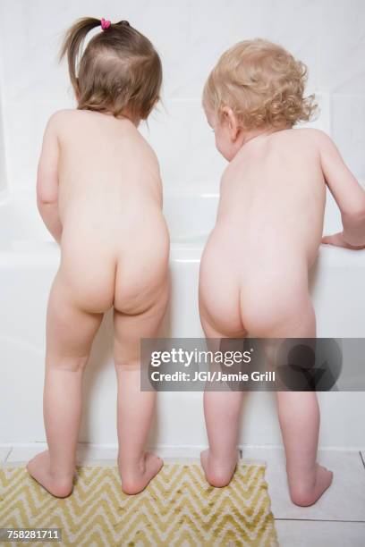 naked caucasian boy and girl standing near bathtub - no clothes girls stock pictures, royalty-free photos & images